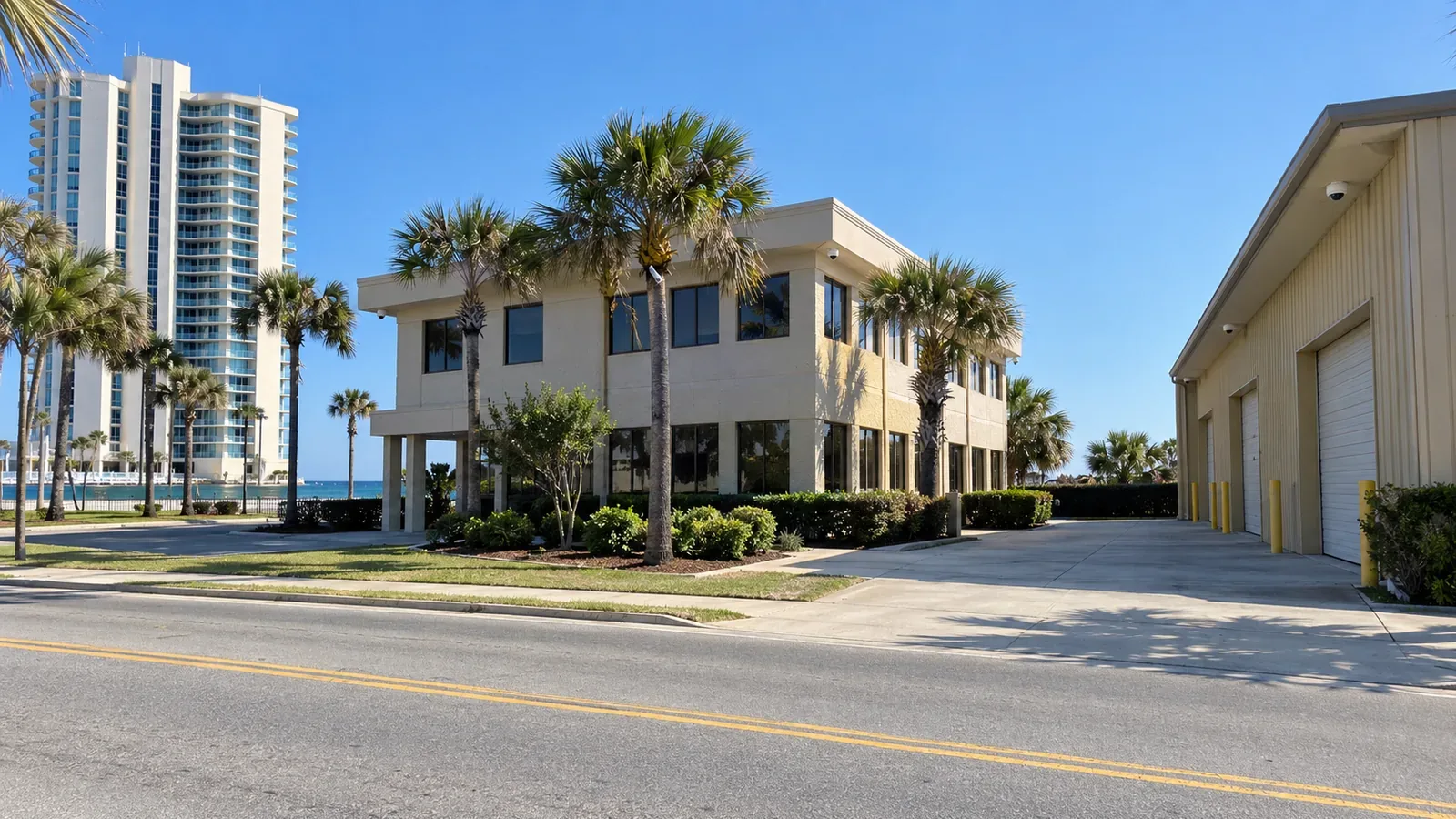 Daytona commercial corridor with an oceanfront hotel, office building and warehouse served by camera and network systems